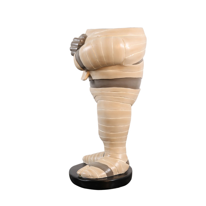 headless mummy statue sideview