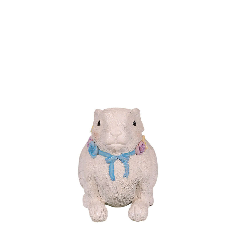 easter rabbit lying down while heads up with flower necklace front view