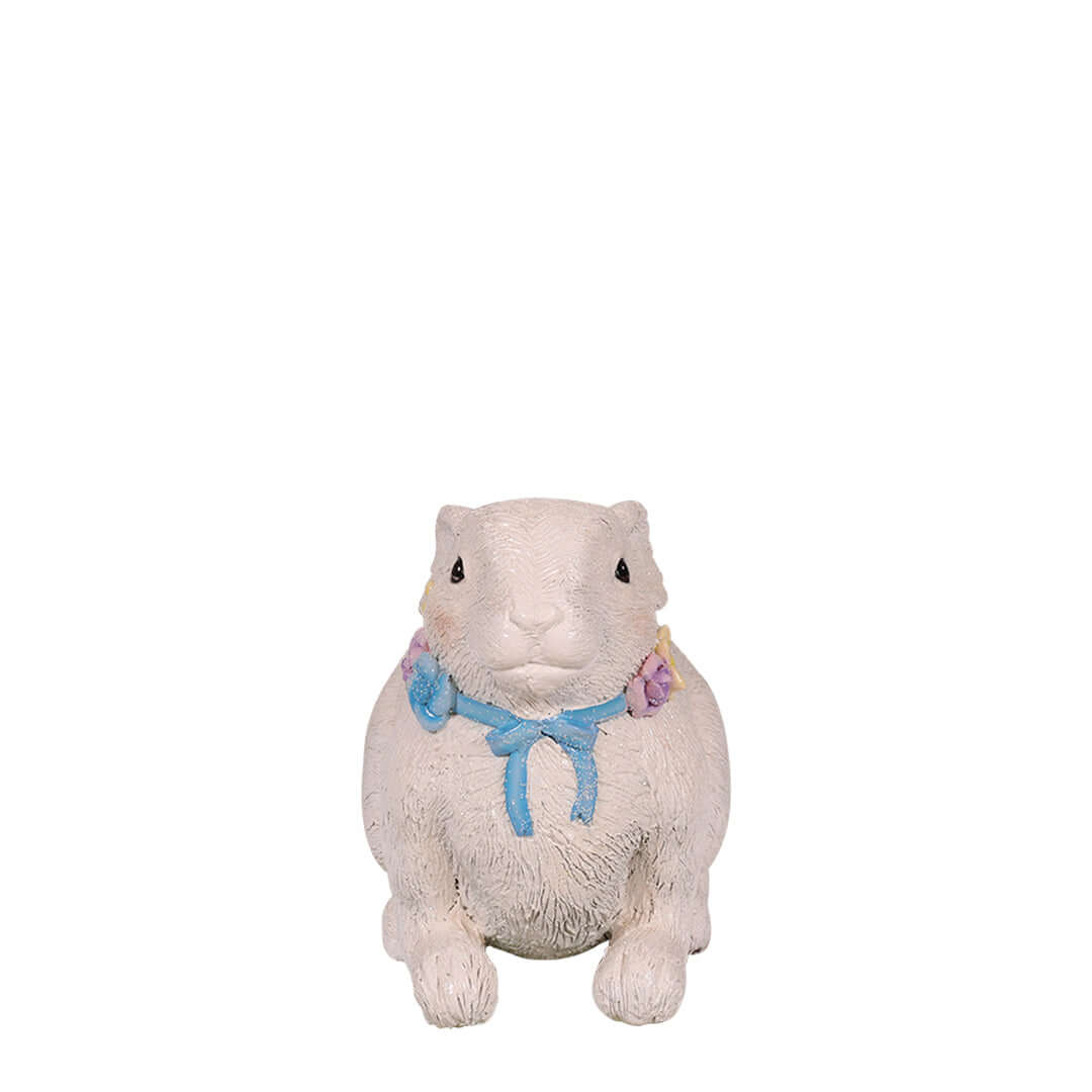 easter rabbit lying down while heads up with flower necklace front view