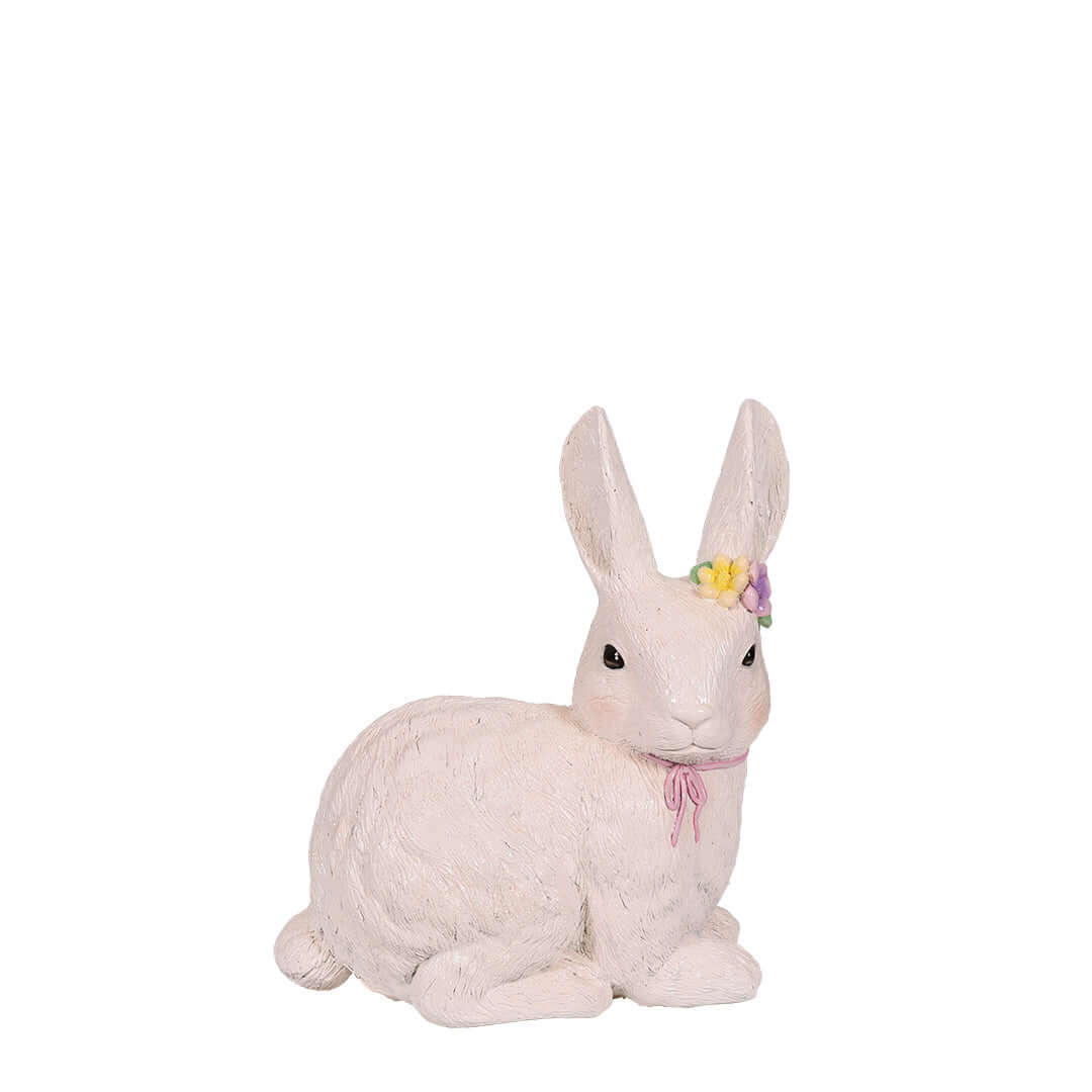 lying white bunny for easter with flower crown