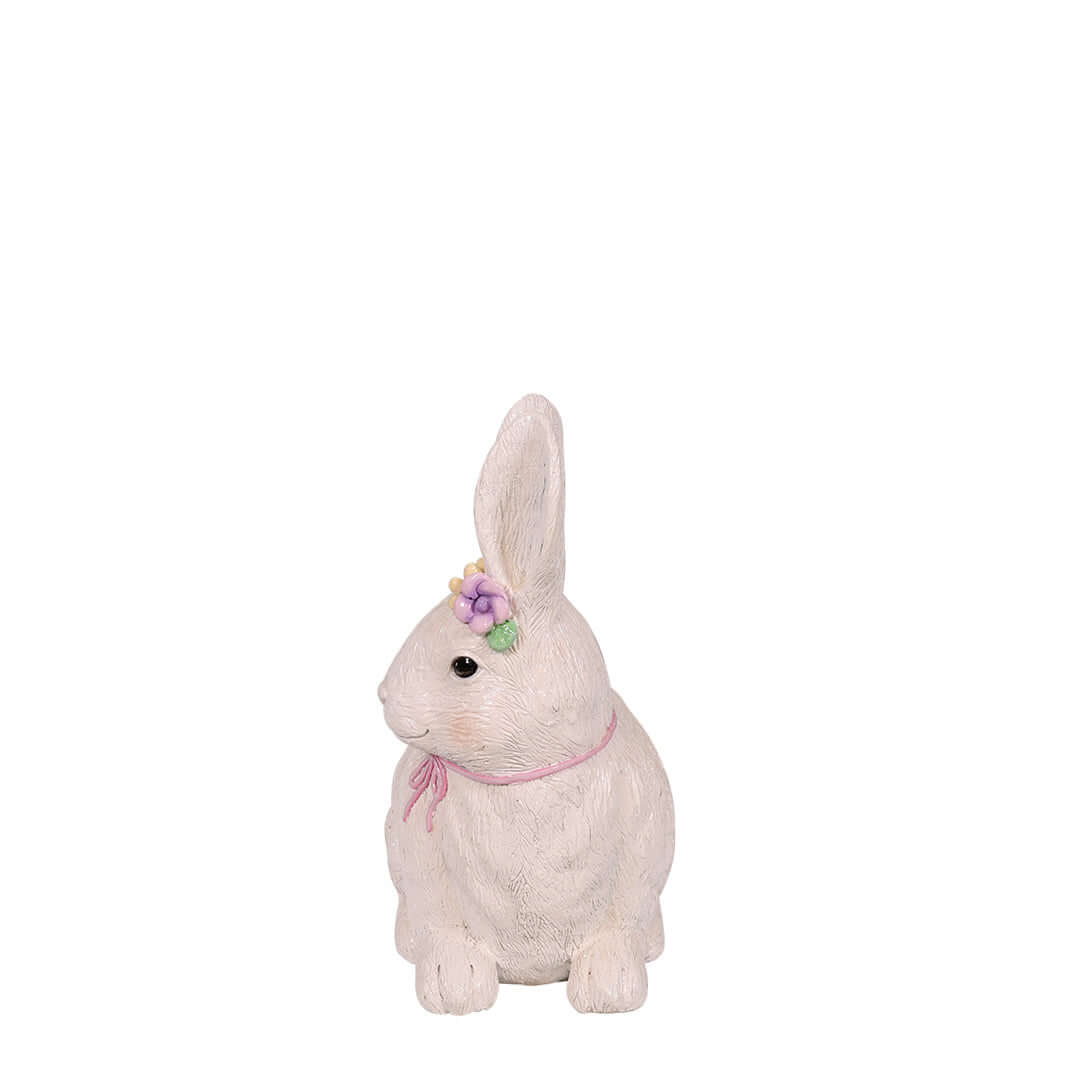lying white bunny for easter with flower crown side view