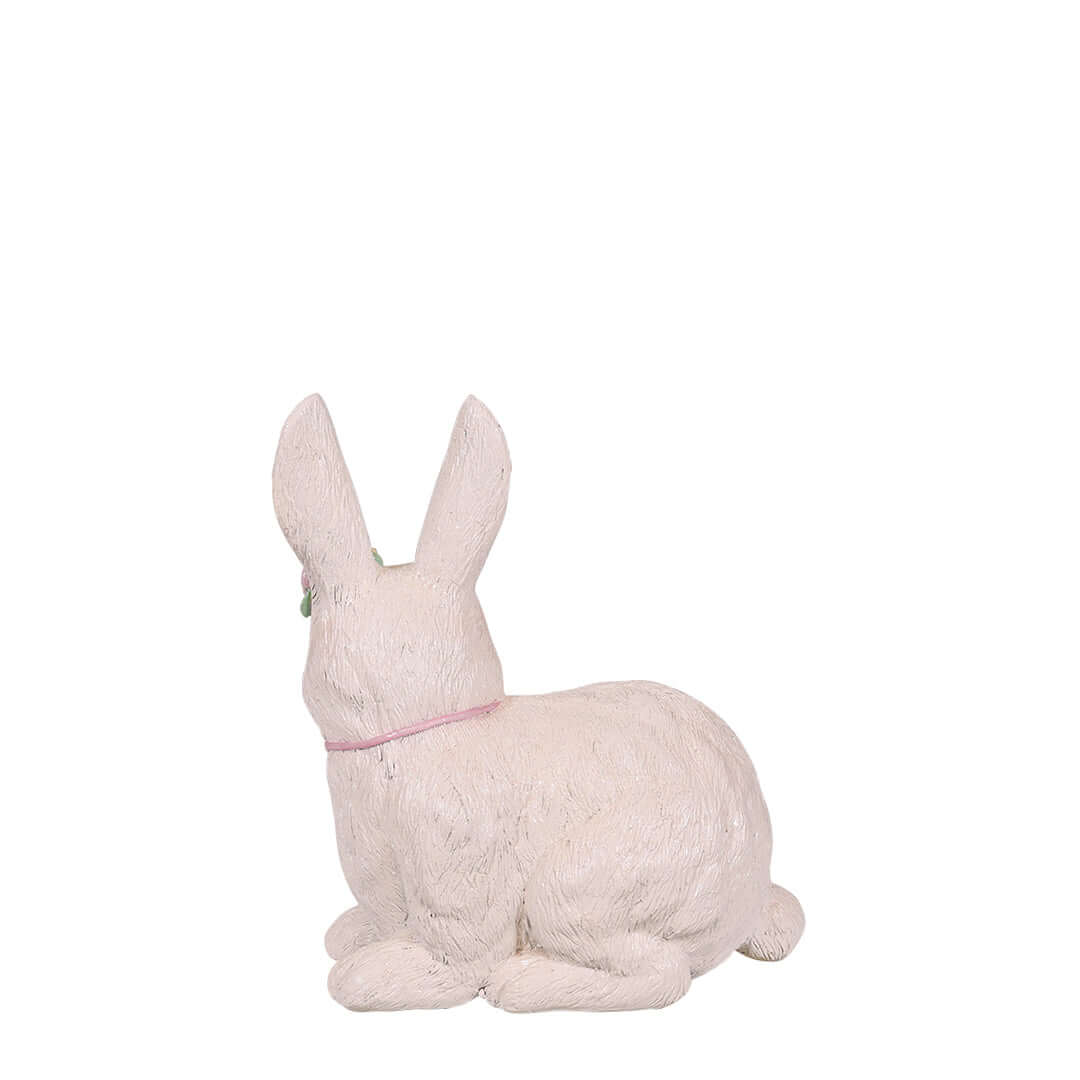 lying white bunny for easter with flower crown back view