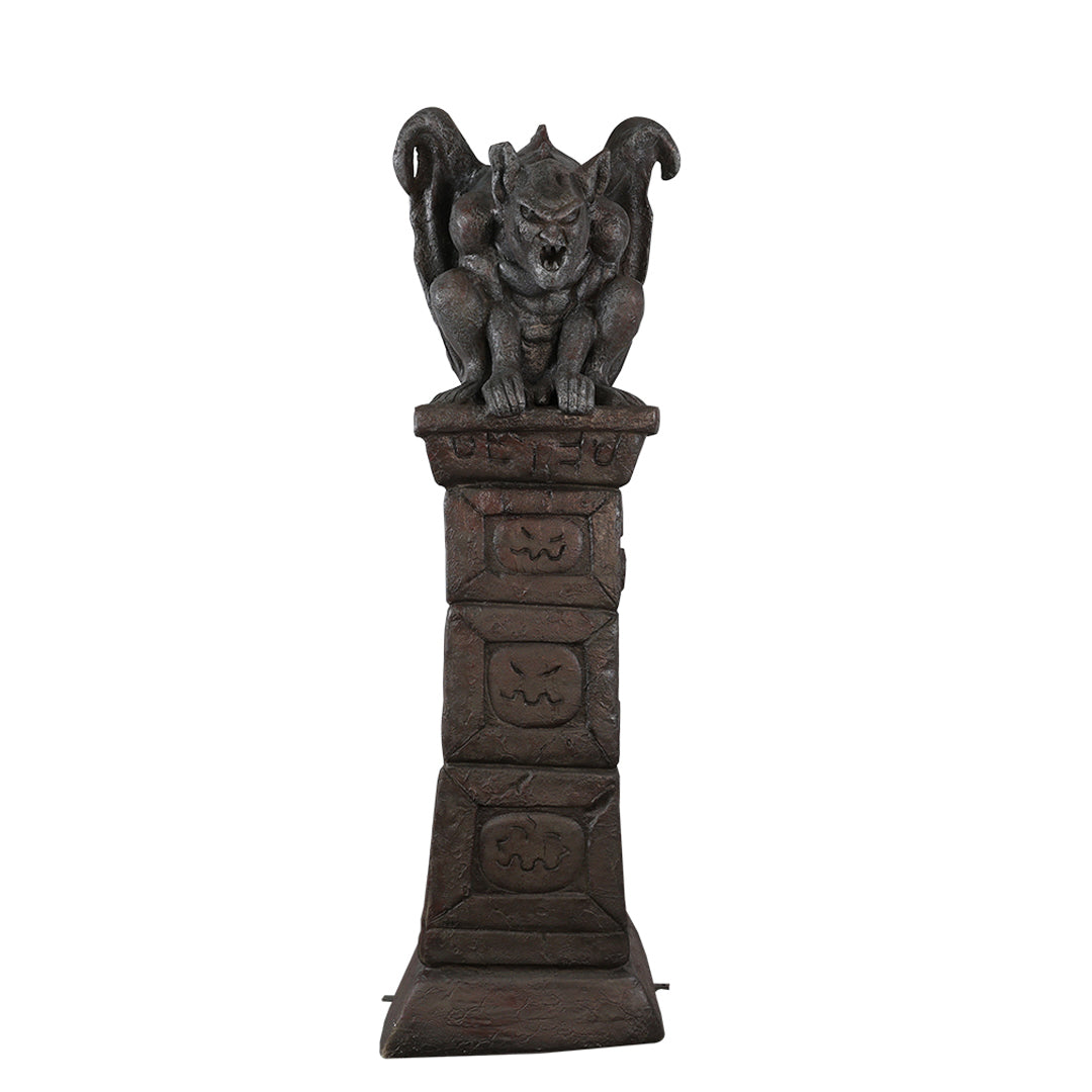 A pillar with a gargoyle on top