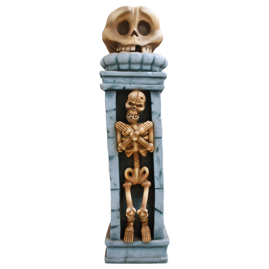 A skull pillar with a skeleton inside facing front